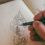 Designer sketching concepts by hand during the logo design process