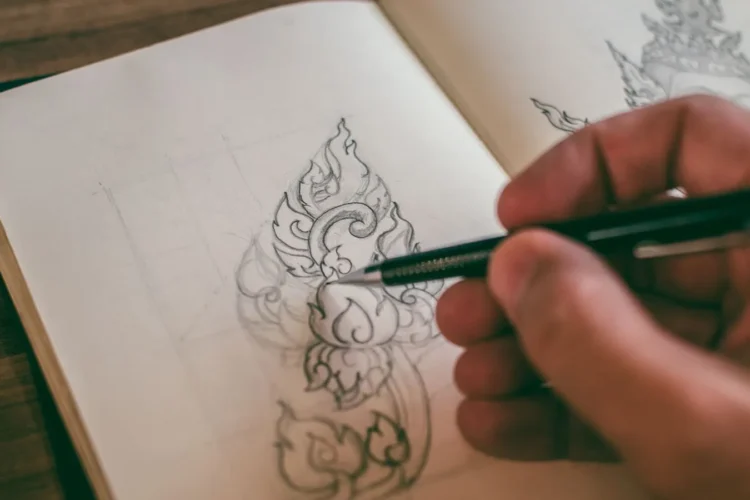 Designer sketching concepts by hand during the logo design process