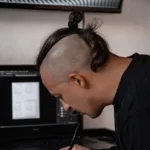 Designer refining a mark against the principles of what makes a good logo