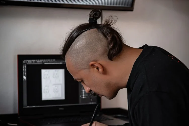 Designer refining a mark against the principles of what makes a good logo